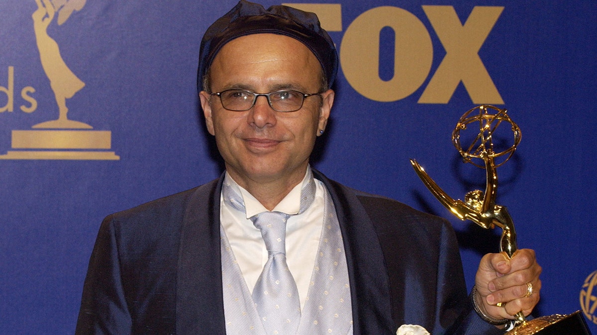 Joe Pantoliano holding Emmy for Outstanding Supporting Actor in a Drama Series at Emmy Awards press room.