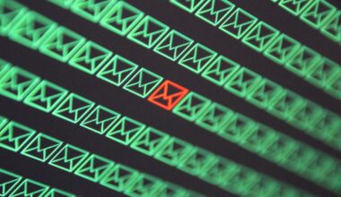 red email envelope in a sea of green email envelopes