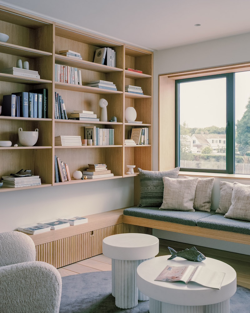 A contemporary Scandi living room with wooden cabinetry
