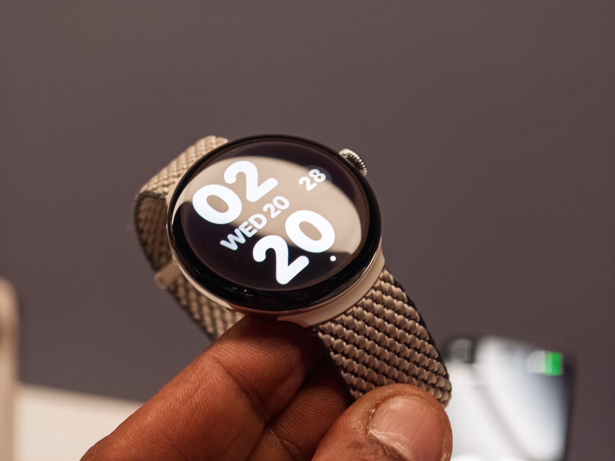 Google Pixel Watch 4 in black in the hand