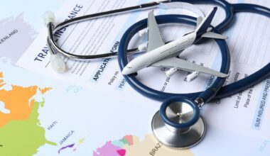 Medical tourism. Travel insurance application form, stethoscope and airplane model on world map, closeup