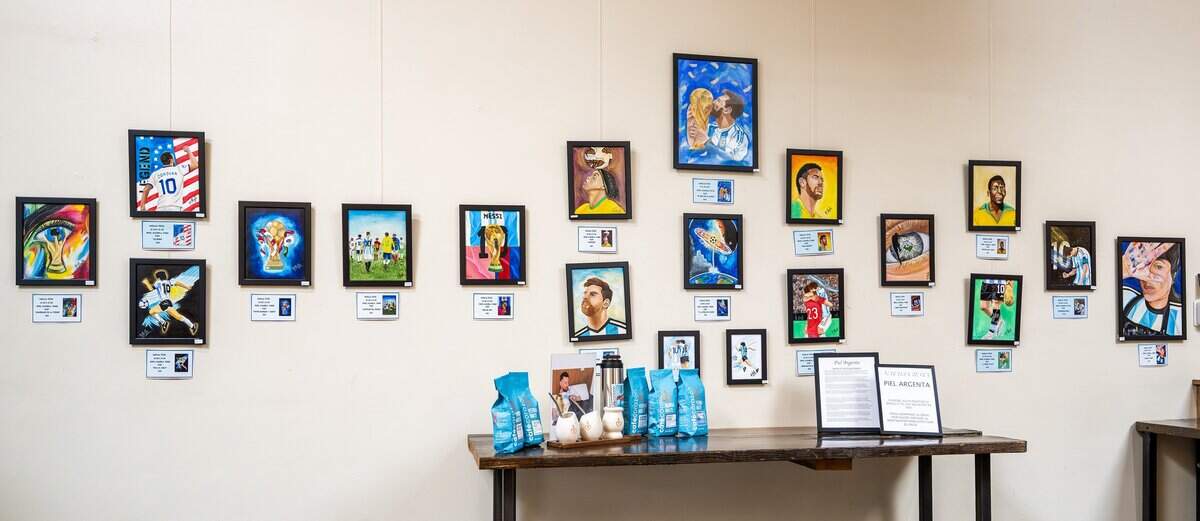 FIFA World Cup-themed artwork by Natalia Testa, an artist from Buenos Aires, Argentina, is displayed for sale in a gallery at the Crossroads location of Café Corazón on Wednesday, June 24, 2026, in Kansas City.