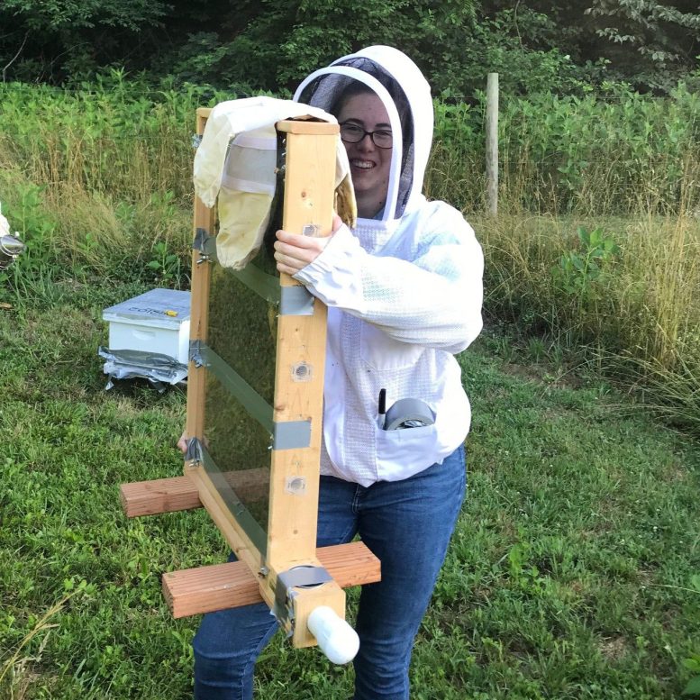 Laura McHenry Holding an Observation Beehive