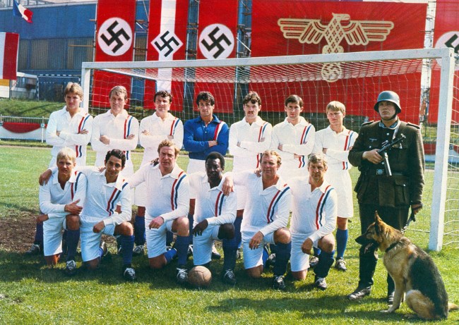 VICTORY, (Top, L-R) Russell Osman, Paul Van Himst, Mike Summerbee, Sylvester Stallone, John Wark, Kazimierz Deyna, Soren Lindsted, (Bottom, L-R) Hallvar Thoresen, Ardiles, Michael Caine, Pele, Bobby Moore, Co Prins, 1981. © Paramount Pictures/ Courtesy: Everett Collection