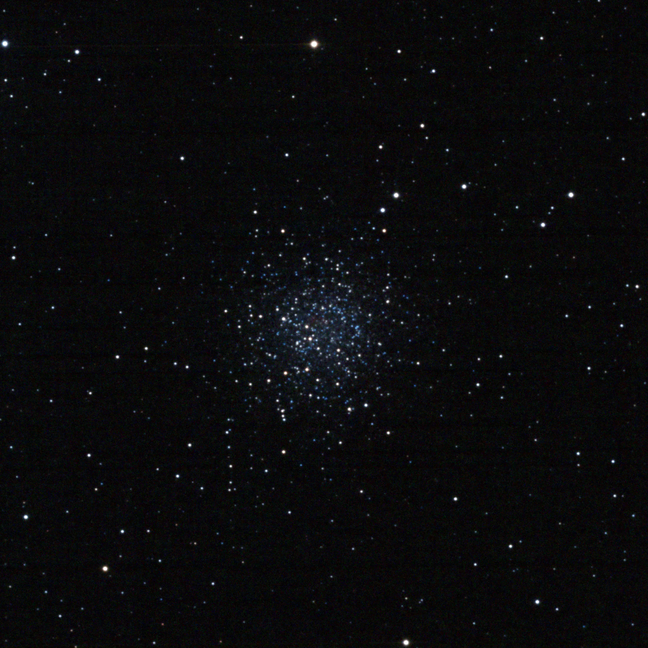 Astrophotograph of NGC 5897, a loose globular cluster appearing as a diffuse, sparkling ball of hundreds of stars — predominantly blue-white — against a black sky background.
