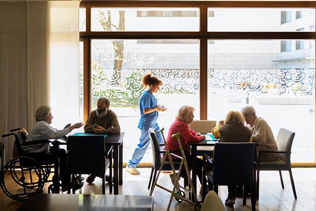 Nurse helping senior residents