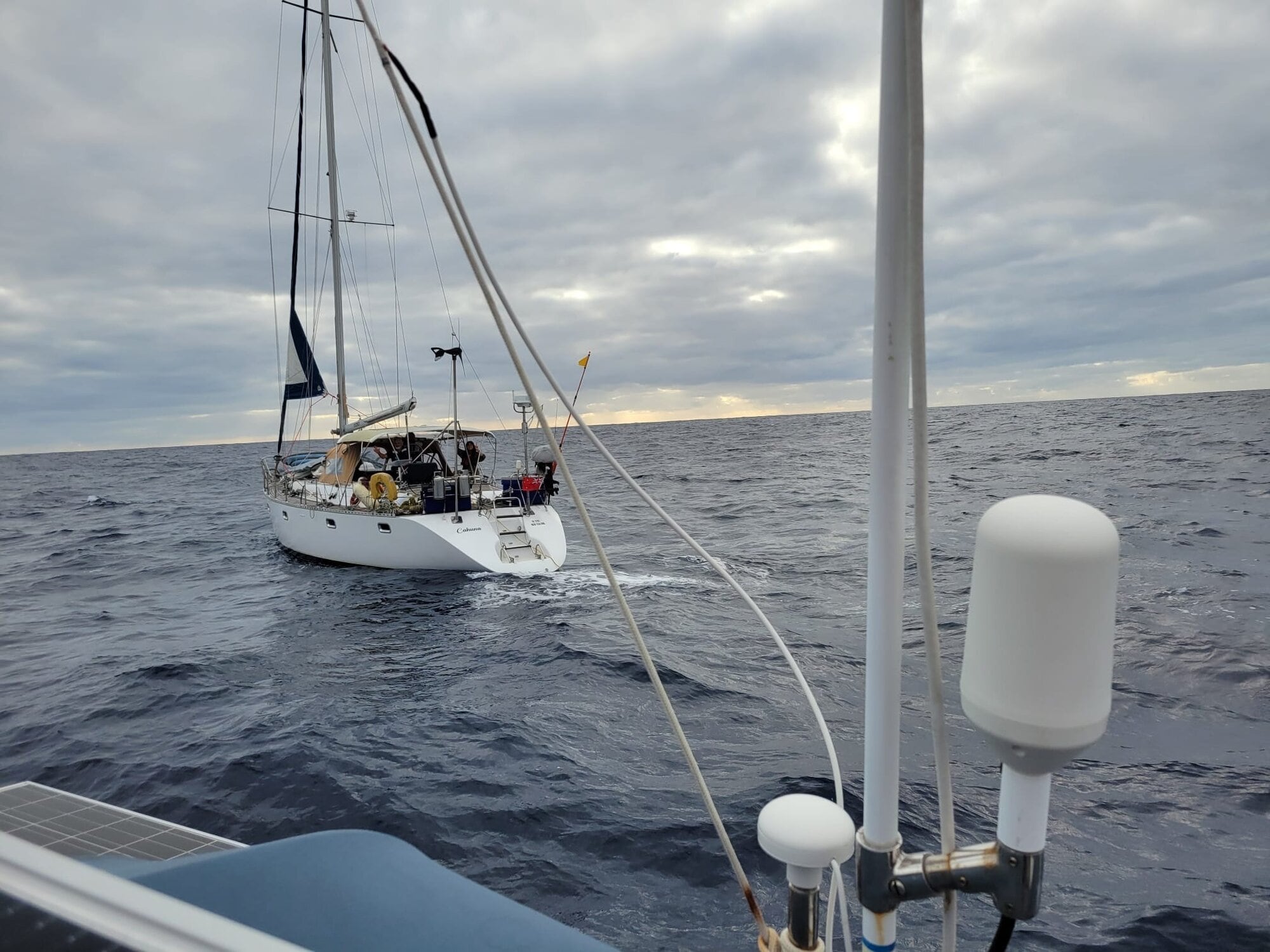  The Cahuna being approached by the Naida so that jerry cans of diesel could be floated across on a line.