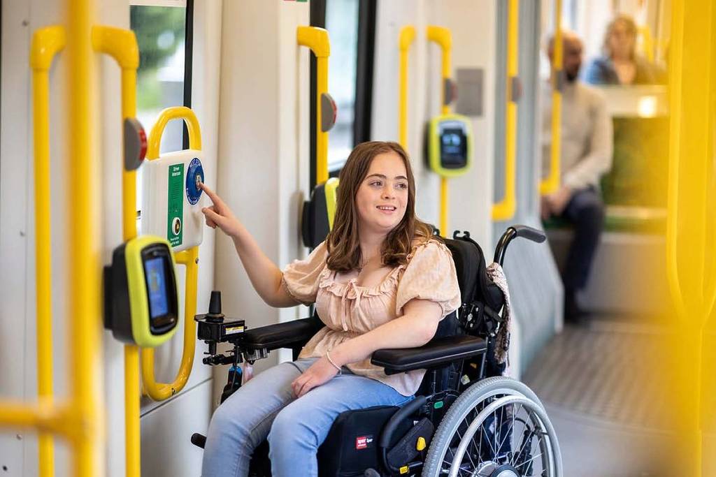 woman using accessibility services to navigate public transport