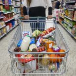 CARDIFF, WALES - MAY 22: A woman with a shopping trolley full of groceries in a supermarket aisle on May 22, 2022 in Cardiff, Wales. Last week, the UK Office for National Statistics reported an 6% average increase of food and drink prices year on year, but some staples, such as milk and pasta, had risen by more than 10%. (Photo by Matthew Horwood/Getty Images)