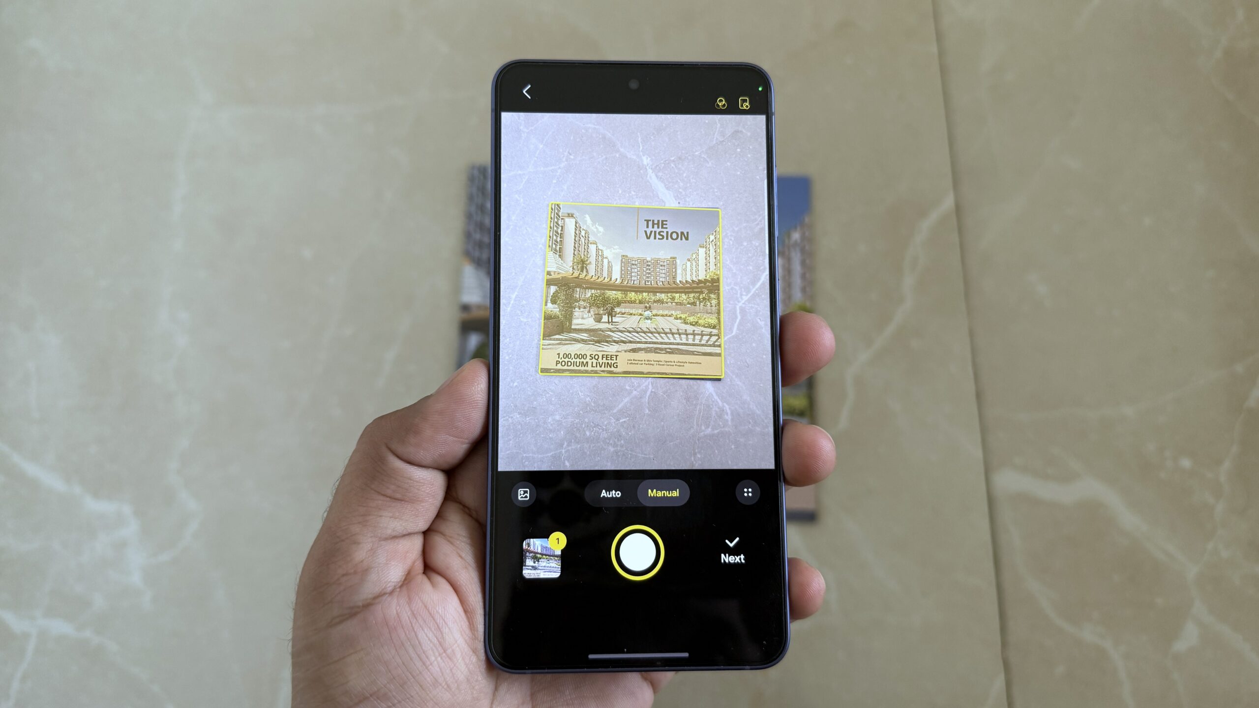 Samsung phone in hand showing scanning a document Samsung phone in hand showing scanning a document
