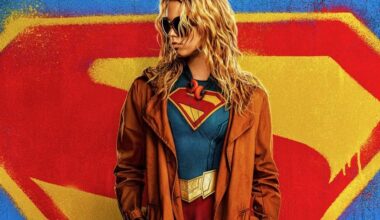 Supergirl appears in front of a big S.