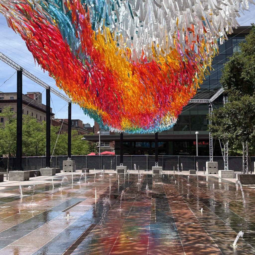 Colorful floating sculpture flying high over Denver Union Station