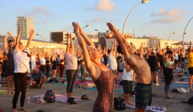 Yoga enthusiasts salute the Tel Aviv sun