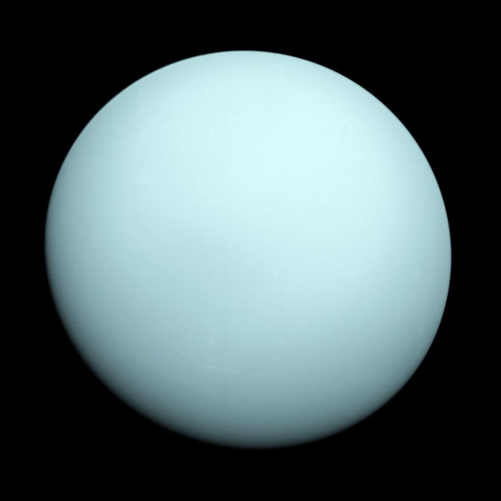 Close-up of a pale blue sphere against a black background, resembling a planet or celestial body.