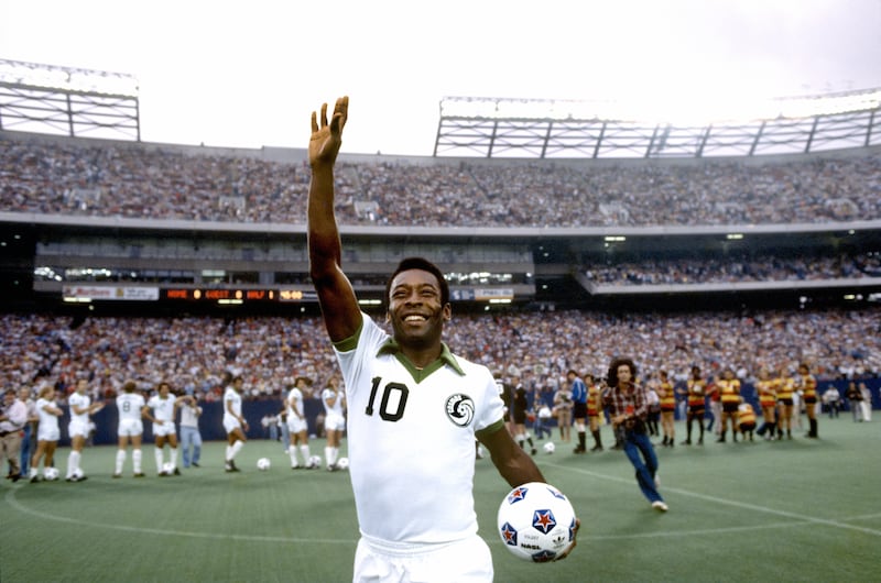 Pele celebrates winning with New York Cosmos against Fort Lauderdale Strikers at Giants Stadium, New Jersey, in 1977. Photograph: George Tiedemann /Sports Illustrated via Getty Images