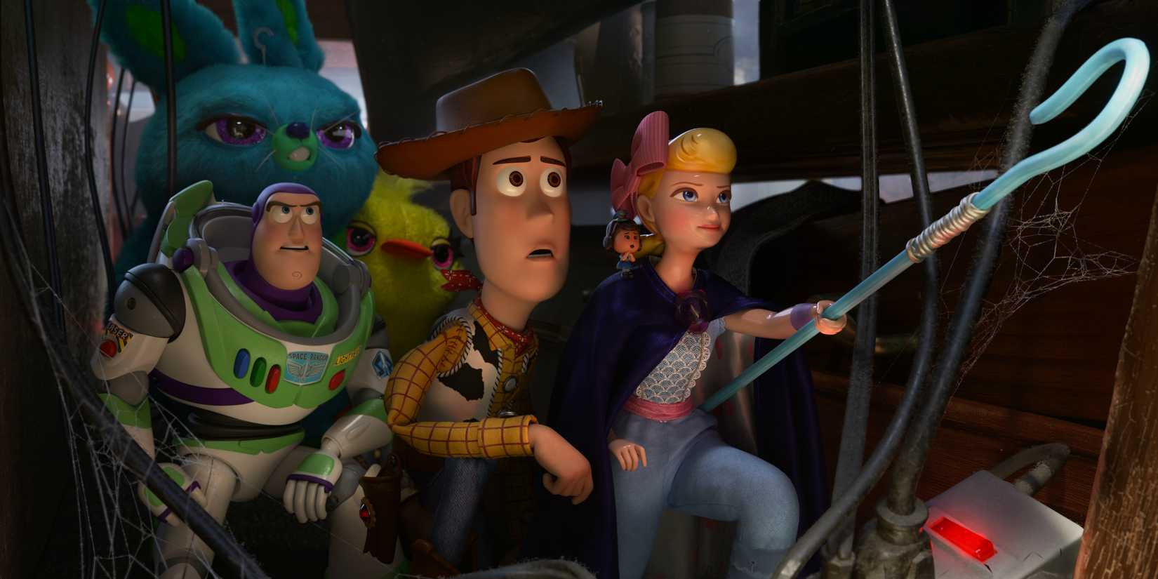 Woody and Bo Peep leading the toys in Toy Story 4 (2019)