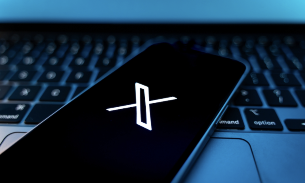 X app on phone atop keyyboard