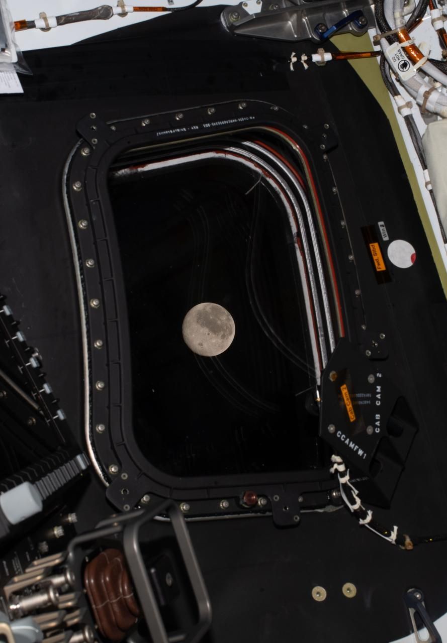 Artemis II crew snapped this photo of the Moon, as it drew close in the window of the Orion spacecraft.