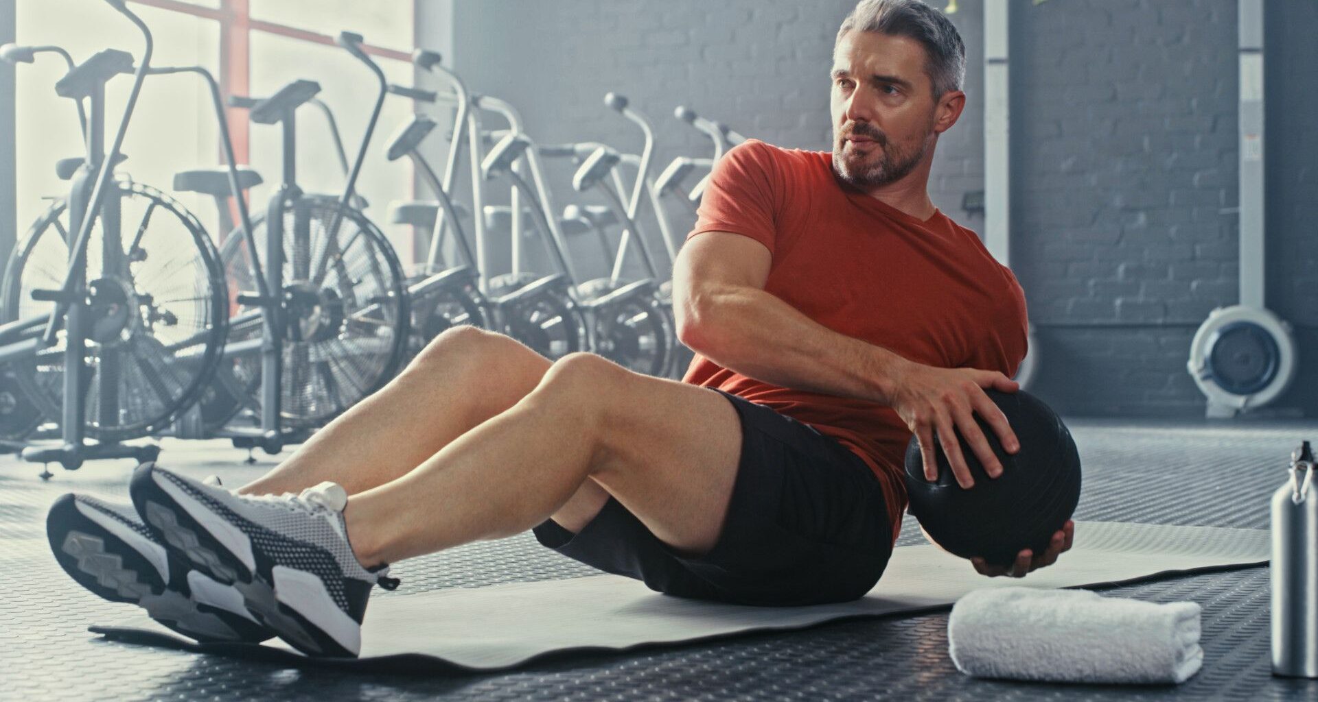 A man doing Russian twists