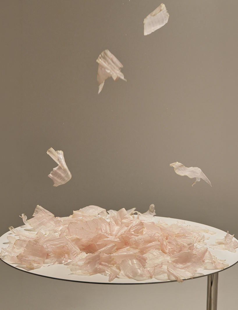 a kinetic installation shaped by shaved bonito flakes forms a continuous display system - 1