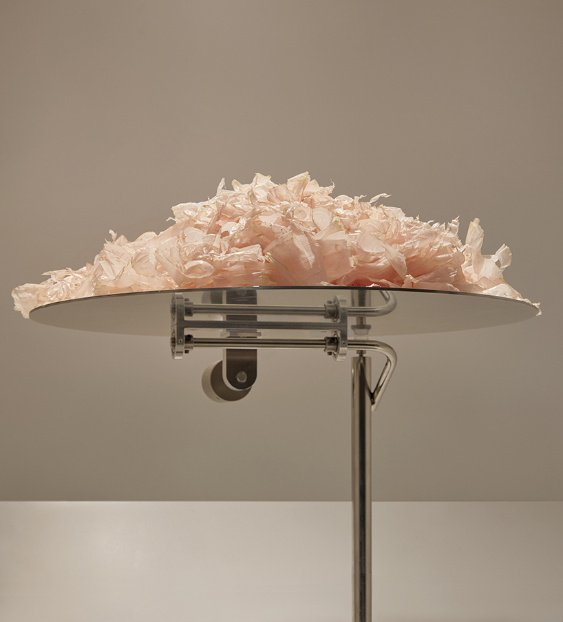 a kinetic installation shaped by shaved bonito flakes forms a continuous display system - 2