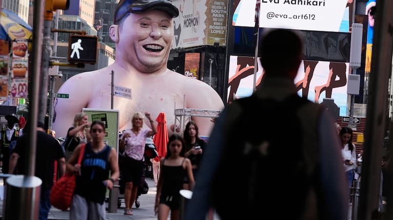 A large inflatable figure depicting Elon Musk stands in Times Square in New York on Thursday, June 11, 2026.