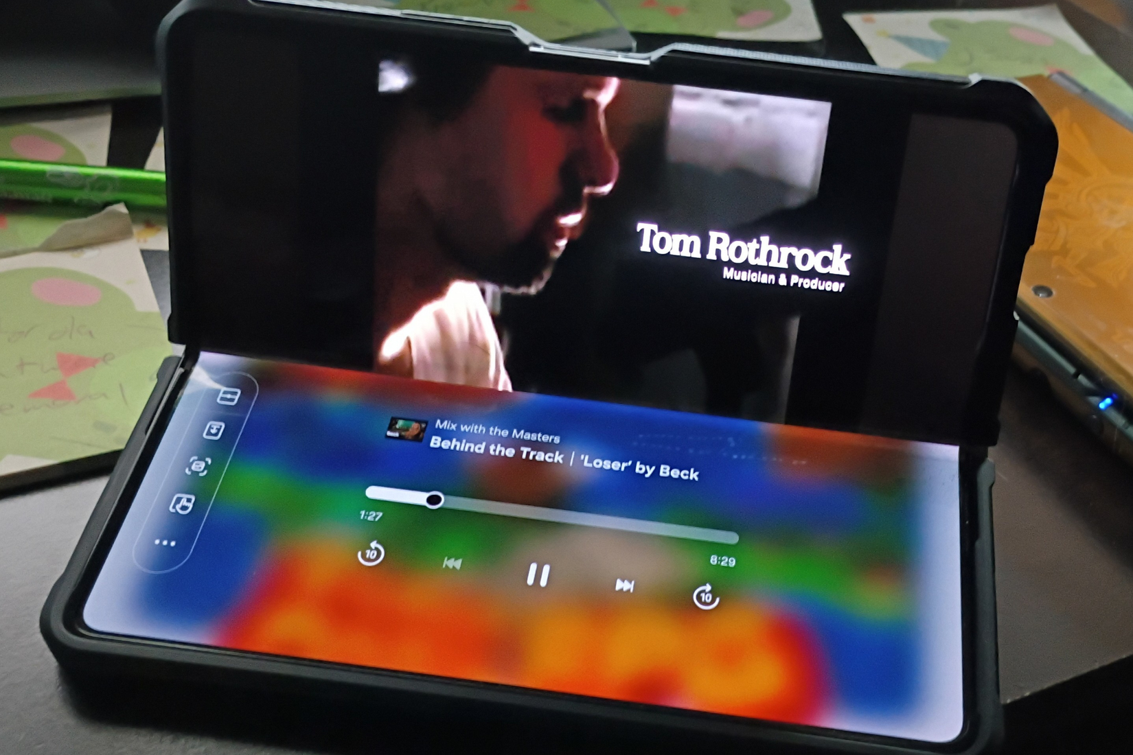 A Samsung Galaxy Z Fold 5 phone open at an angle in Flex mode.