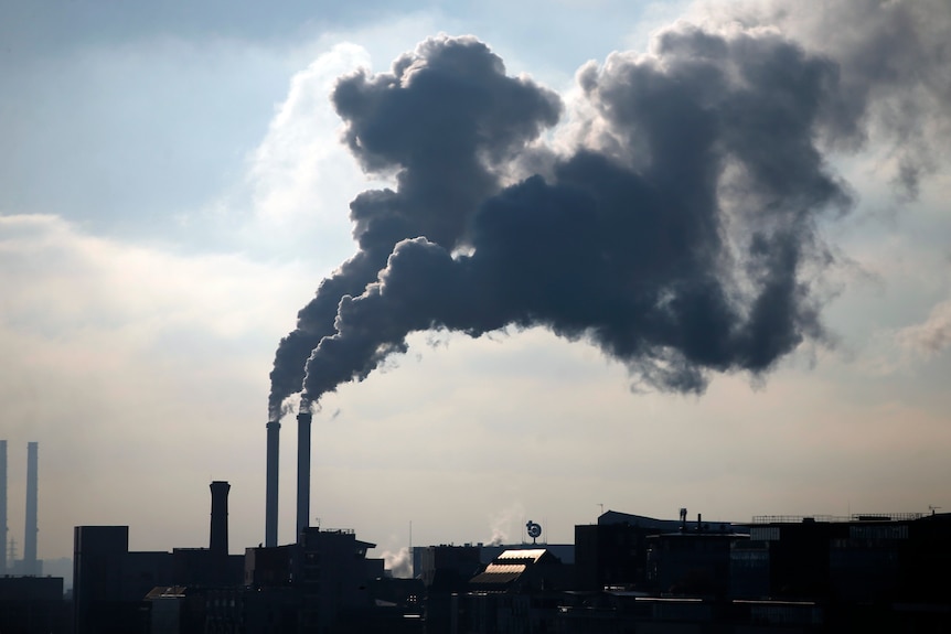 A picture of industrial smoke stacks