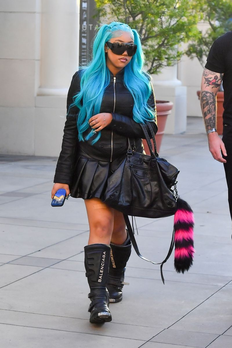 North West rocks an all-leather look, hand piercings and signature blue hair in Los Angeles