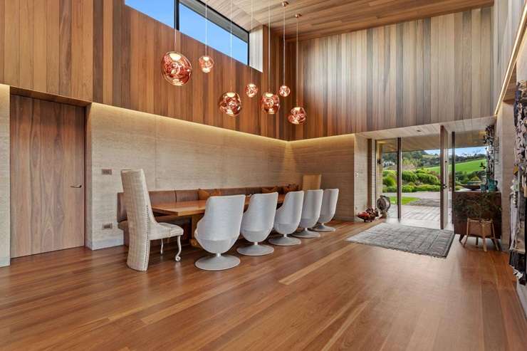 The three-bedroom rammed-earth home at 97 Sharp Road, in Matakana, is known locally as Obsidian House. Photo / Supplied