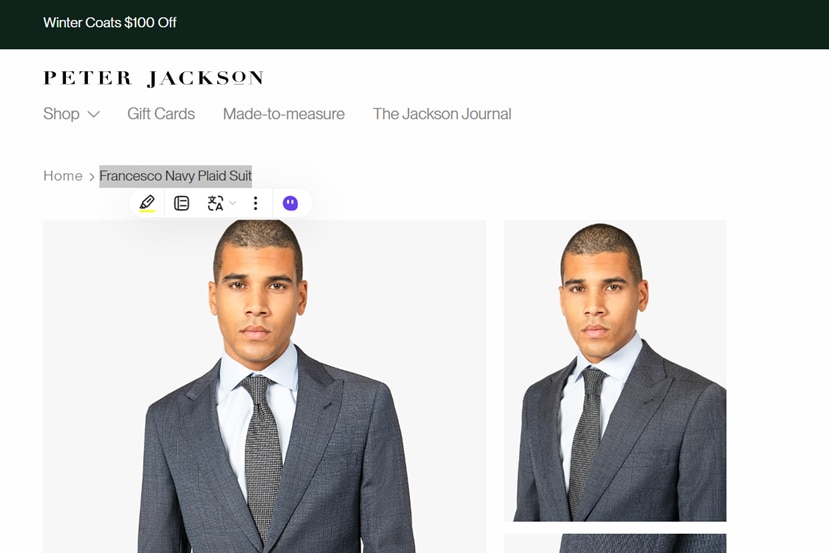 A screenshot of a fashion website selling a navy suit, with a male model.