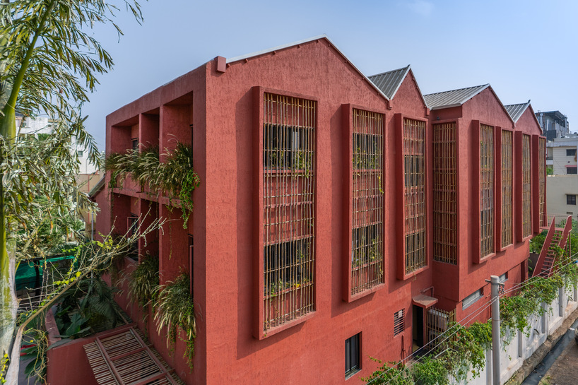 underused house reconfigures into child-centered bright red preschool in india - 3
