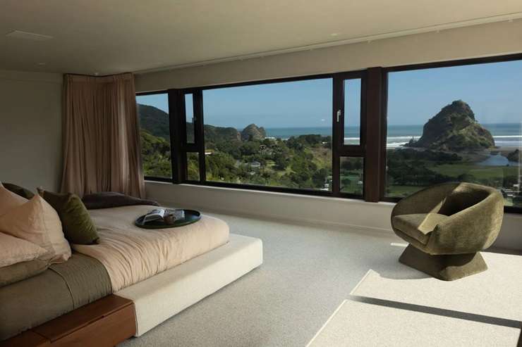 Jenene Crossan and Scottie Chapman are selling their luxury seven-bedroom beach escape at 27 Glenesk Road, above Piha’s Lion Rock, on Auckland's west coast. Photo / Supplied