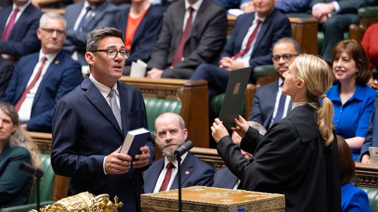 Andy Burnham, front left, is sworn-in as an MP in the House of Common in London, England.