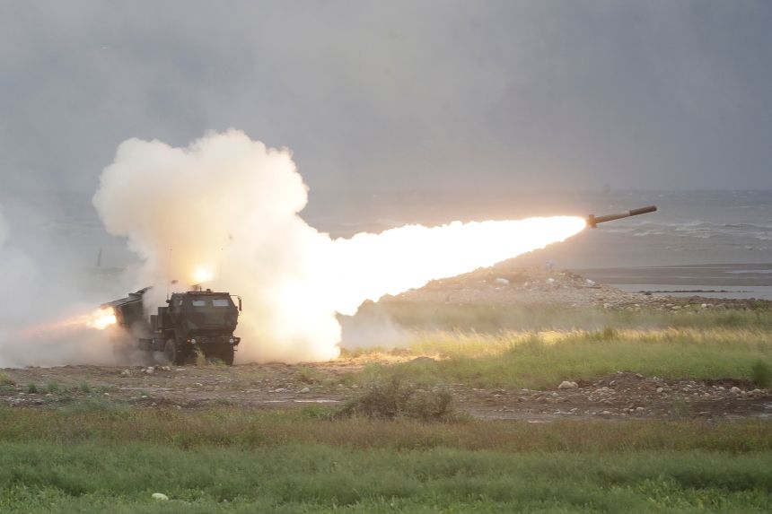 A rocket is launched from a High Mobility Artillery Rocket System (HIMARS) during a military live-fire shooting training in Taichung City, Taiwan, Wednesday, June 10.