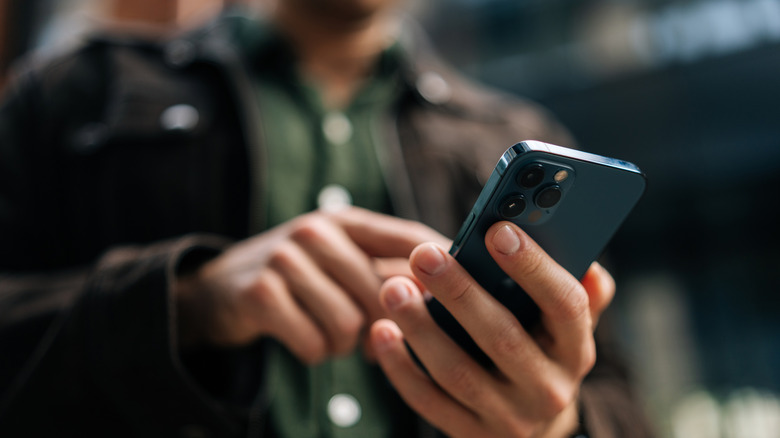 Man holding an iPhone in-hand