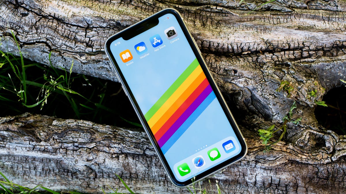 iPhone 11 with rainbow wallpaper