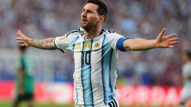 Argentina's Lionel Messi (10) celebrates after scoring the opening goal during the World Cup Group J soccer match between Argentina and Algeria in Kansas City.