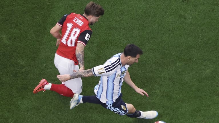 Argentina's Lionel Messi, center, scores the opening goal during the World Cup Group J soccer match between Argentina and Austria in Arlington, Texas, near Dallas.