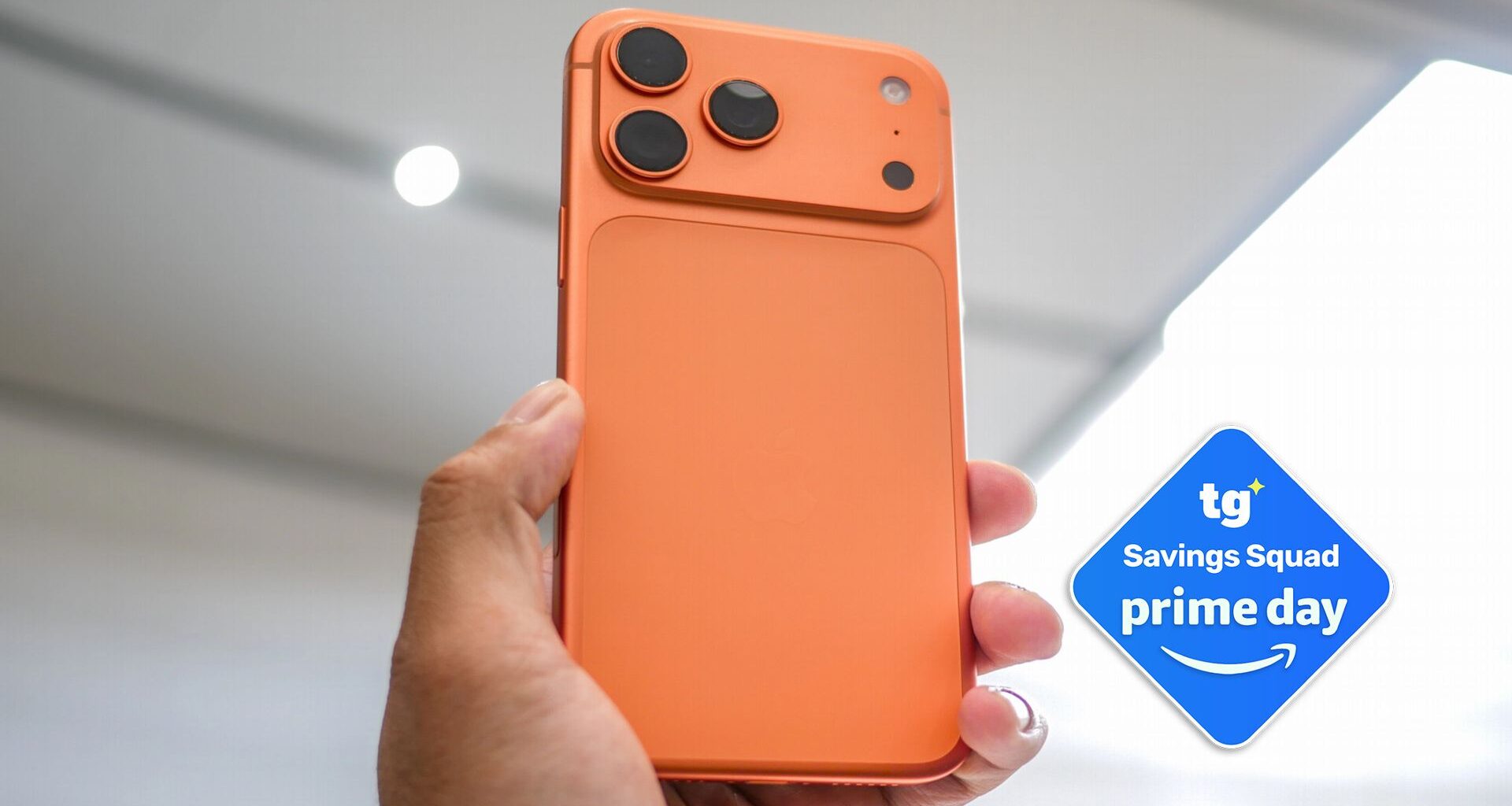 iPhone 17 Pro held in the hand with Prime Day badge.