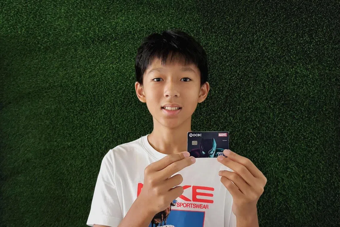 Oliver Png, 13, used physical cash to pay for things when he was younger, and was given an OCBC debit card for children in early 2025, when his mother felt he could better grasp how to manage money.
