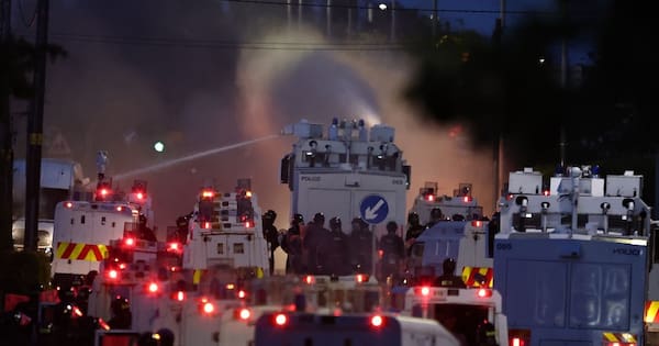 Protesters hit by water cannons after Belfast stabbing attack