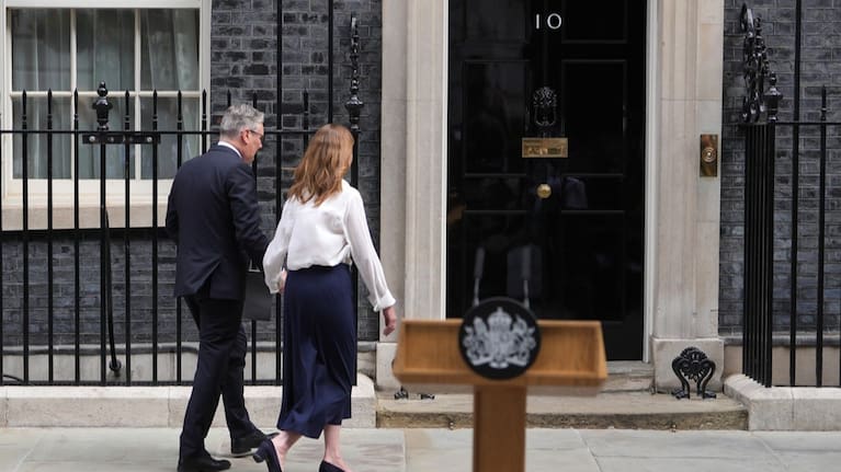 Britain's Prime Minister Keir Starmer and wife Victoria walk back inside 10 Downing Street after speaking to the media in London.