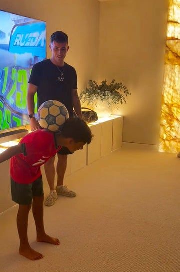 Young Mateo joined the older boys for a soccer session during the birthday celebration.