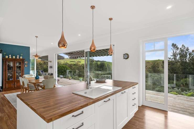 A two-bedroom cottage at 614 Kaitemeko Road, in Welcome Bay, comes with its own special piece of protected bush. Photo / Supplied