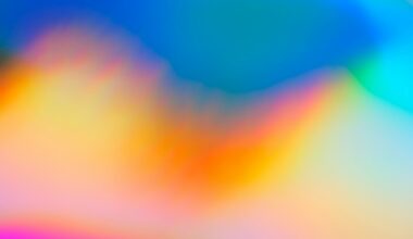 a blurry image of a rainbow colored background