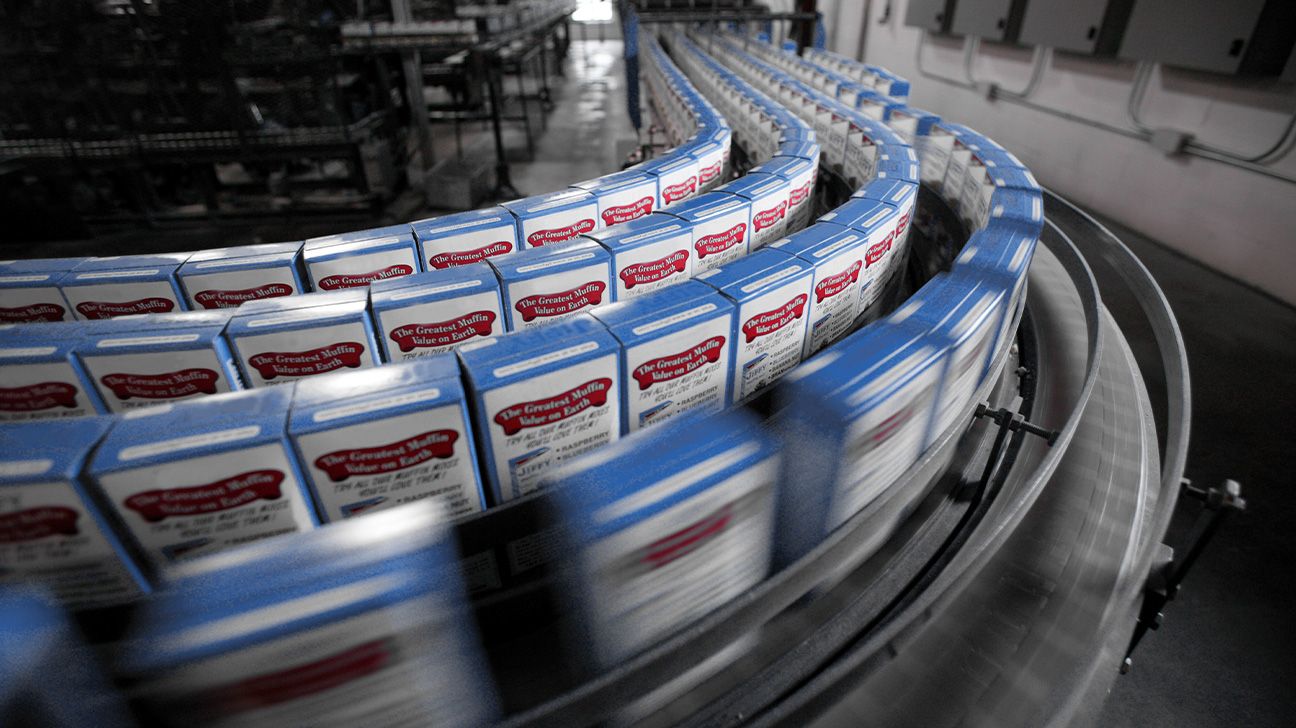 Cake mix moving past on a factory line