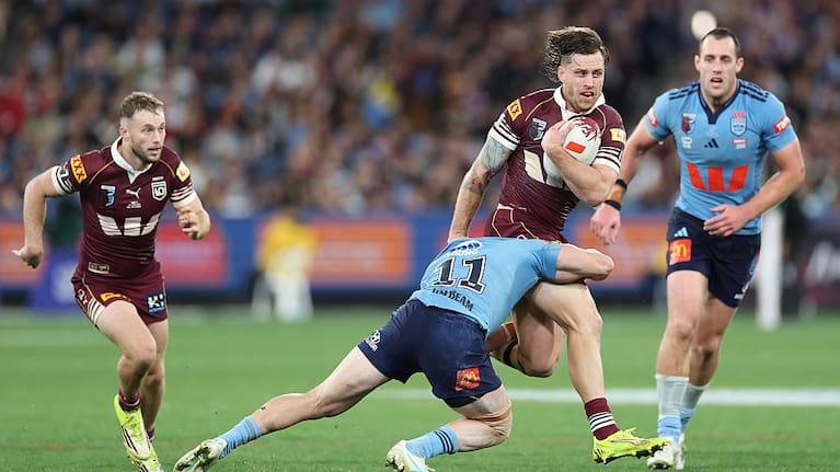 Cameron Munster of the Maroons runs the ball during game two of the Men's State of Origin series between New South Wales Blues and Queensland Maroons .