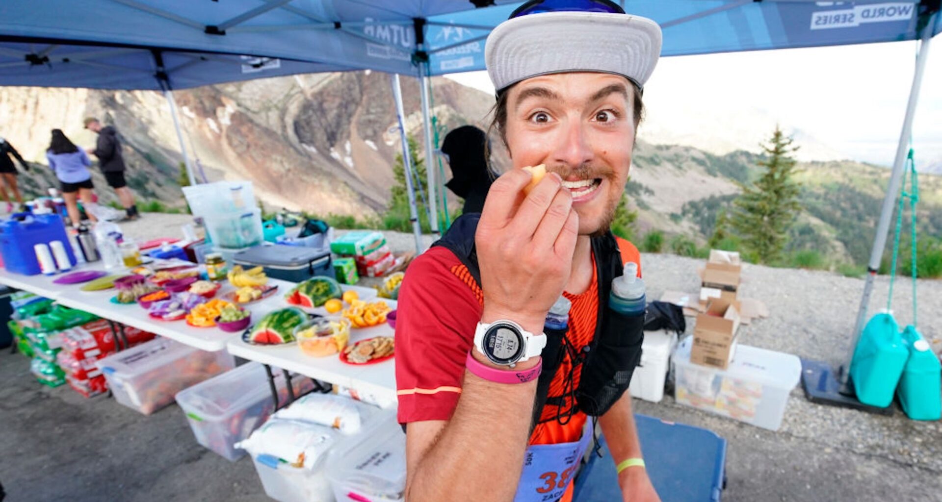 Zachary Russell stops at the Hidden Peak aid station in the UTMB World Series: 50K Speedgoat Mountain Race on July 23, 2022 in Snowbird, Utah.