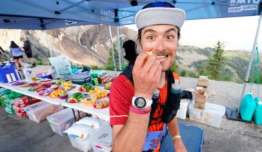 Zachary Russell stops at the Hidden Peak aid station in the UTMB World Series: 50K Speedgoat Mountain Race on July 23, 2022 in Snowbird, Utah.